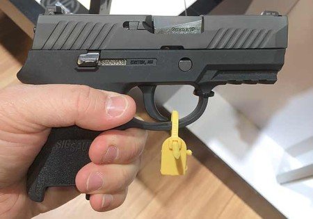 The P320 Compact just fit my hand, where the magazine would sit flush with the grip base (photo from gunsholstersandgear.com).