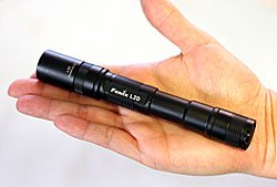 The Fenix L2D flashlght is compact enough to fit entirely into your hand.