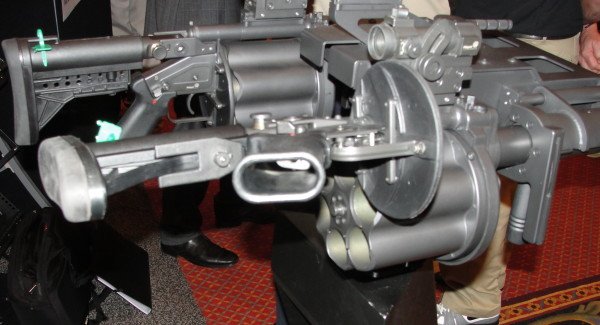 The 6-barrel launcher has a unique break-open system where the receiver actually folds out instead of the cylinder. And yes, that is a dual-mounted 6-cylinder system being developed for military operations.