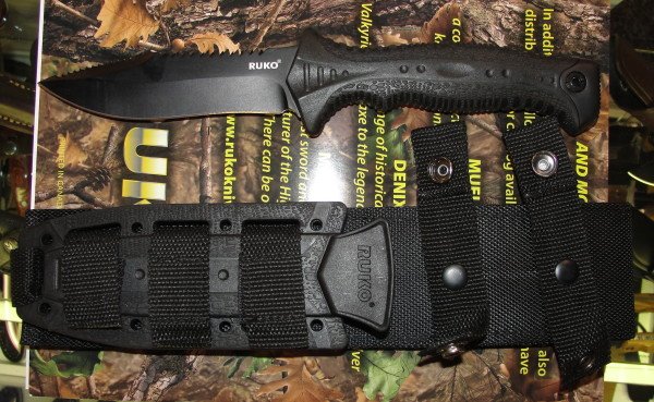 The RUKO Tactical knife with its nylon/rubber holder.