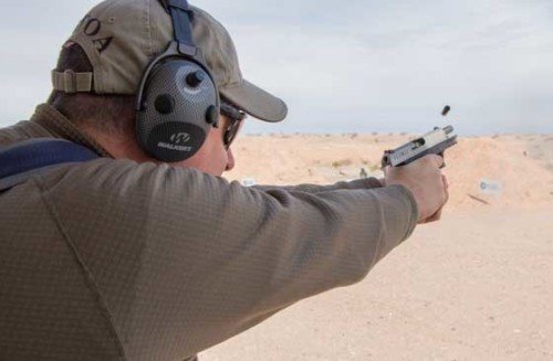 The Author using the Walker's Alpha SSL hearing protection muffs at Industry Day at the Range. Note the (2) microphones, instead on one.