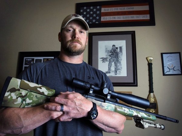 A picture of Chris Kyle holding his GA Precision Gladius rifle.