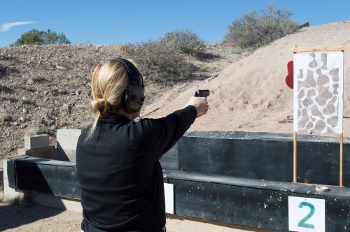 A female shooter putting rounds through the RM380.