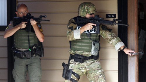 Douglas County Sheriff's Deputies search Umpqua Community College for the shooter (photo by News Review/NR Today)