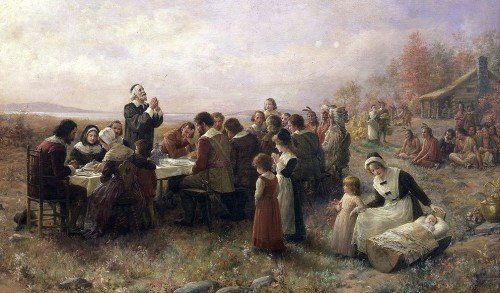 Pilgrims celebrating the first Thanksgiving in 1621 (painting by Jennie Augusta Brownscombe, 1914).