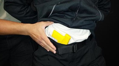 Here the small pistol is located inside of the suspect's waistband (photo by Boydd Products).