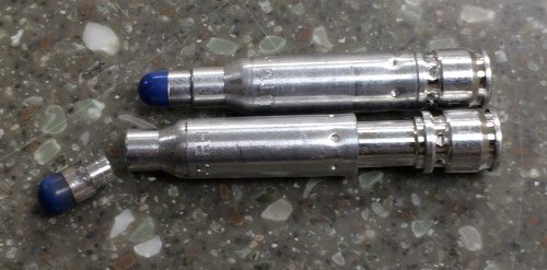 A non-fired CTA round above, and the fired version below. Notice the case extension - as designed.