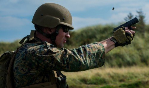 Sgt. Devin Hughes of the Marine Shooting Team firing a Glock 19.