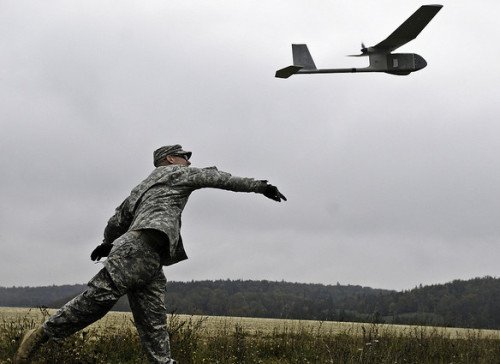 Sgt. Jason E. Gerst, launches the RQ-11B Raven unmanned aerial vehicle (photo on Flickr).