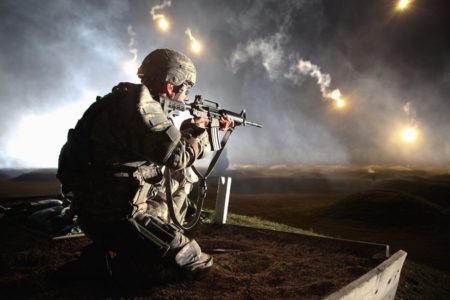 An Army soldier firing the Colt M4 carbine (photo by Army Specialist Venessa Hernandez).