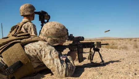 A U.S. Marine fires the M27 IAR HK 416) during training photo by U.S. Marines).