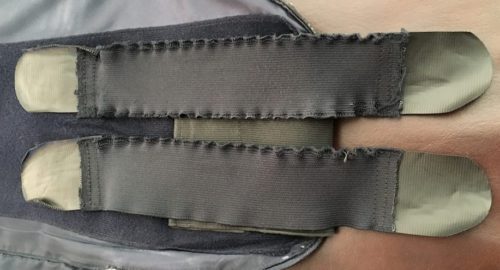 The original armor straps have frayed and curled, making them much less useful.