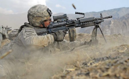 U.S. Soldier fires the M249 SAW at Afghan insurgents (photo by PEO Soldier Live, DoD).