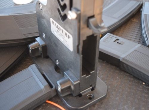 The Mag Pump accepts mil-spec magazines, and releases mags by pressing down on the lever above.